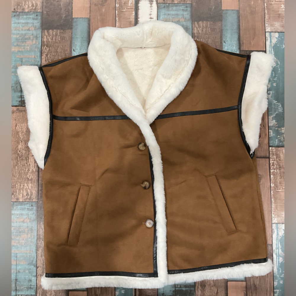 Faux suede and fur brown vest with black leather detail size large with pockets